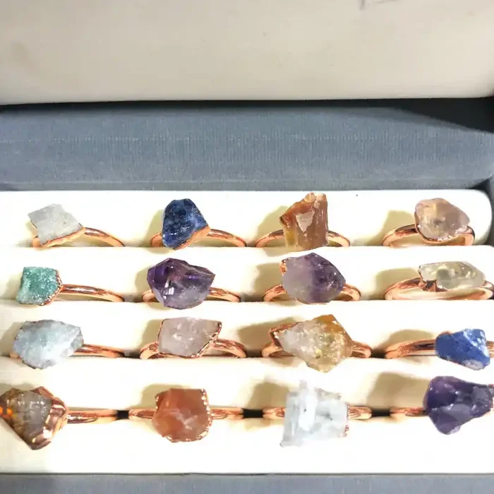 16 Raw Gemstones in copper rings Br 2449